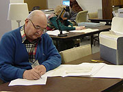 Volunteers assist the archivist