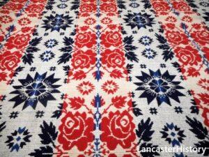 Fabric piece with red and blue star and flower figures