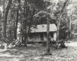 Two story frame cabin on Baker's Island in 1907 after a strong rock blast.