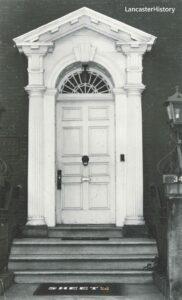 Fancy pedimented wooden doorframe