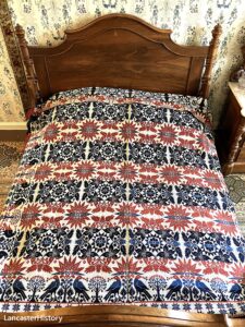 A coverlet on a bed