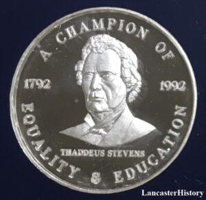 Head and shoulders image of Thaddeus Stevens on a silver coin