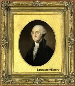 Portrait of George Washington in a gold frame and oval mat