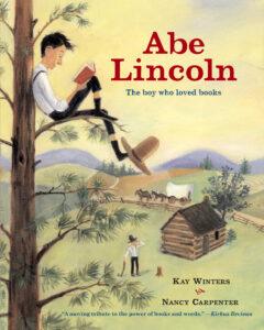 The book cover of "Abe Lincoln" with an illustrated cover of a book sitting in a tall tree reading.
