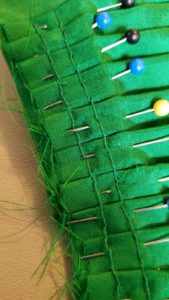 Image of a double row of back stitches for a pleated skirt.