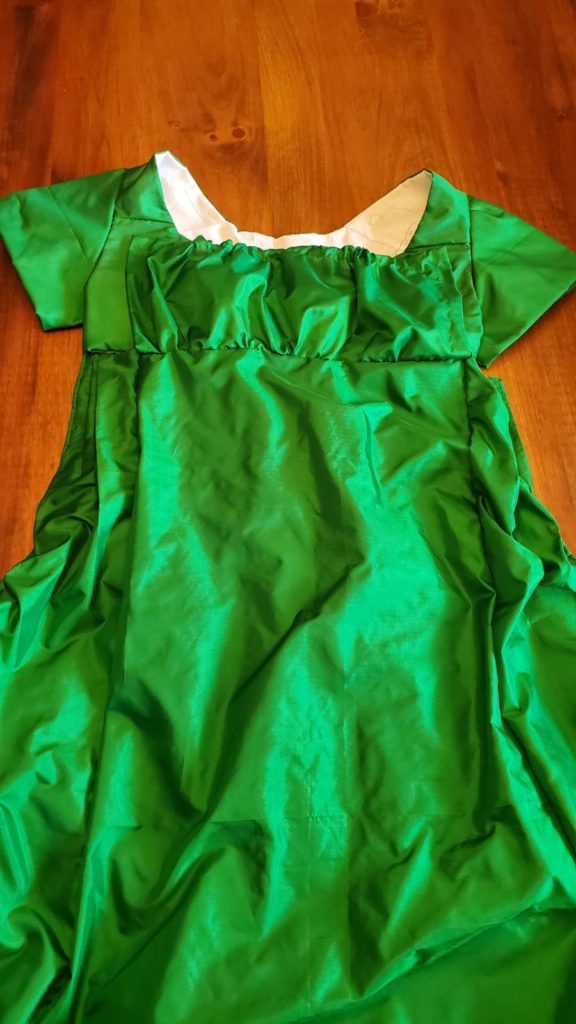 Gown with bib front pulled up