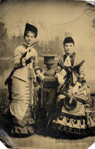 A tintype of a pair of young ladies from c. 1880.