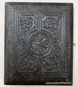 A leather case of a daguerreotype or ambrotype. Features a very intricate pattern.