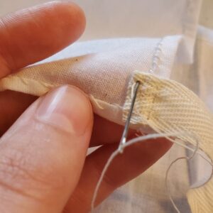 Stitching down the cotton tape to the bodice lining