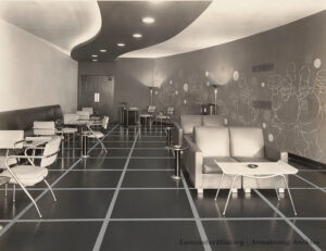 Executive Lounge of the Continental Backing Company. Note the fanciful decoration on the right side wall. Photo: LancasterHistory, Armstrong Archive.