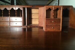 Desk interior showing removal of prospect box