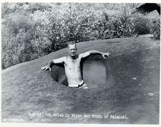 A man in a Susquehanna water-filled pothole.