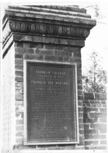 Bronze plaque on brick column