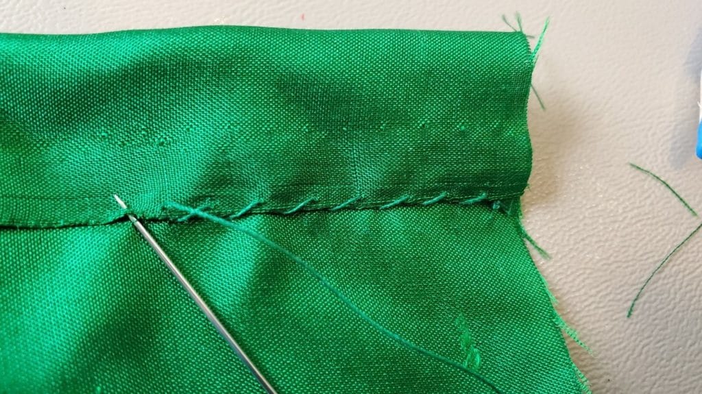 Hem stitching the top channel of the bodice front piece.