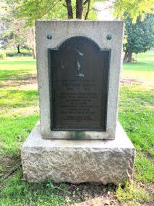 Brass plaque on a stone monument