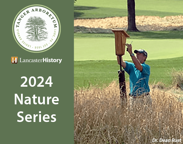 A graphic with a color photograph of a man with light skin tending to a bird house on a golf course.