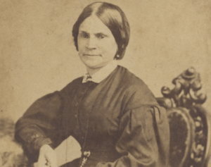 A historic photograph of Lydia Hamilton Smith, seated on a chair in a dress.