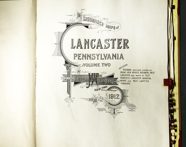 Image from the inside cover page of a book of insurance maps of Lancaster County.