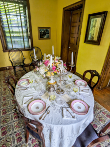 Dining Room table at Wheatland set with Pink Parisian china.