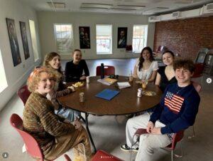 Group of students sitting around a table