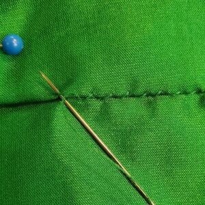 Hem stitching the tie to the front skirt