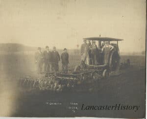 Ten horsepower tractor at work on the farm of Grove Locher [undated]