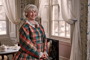 A volunteer in period costume at Wheatland.