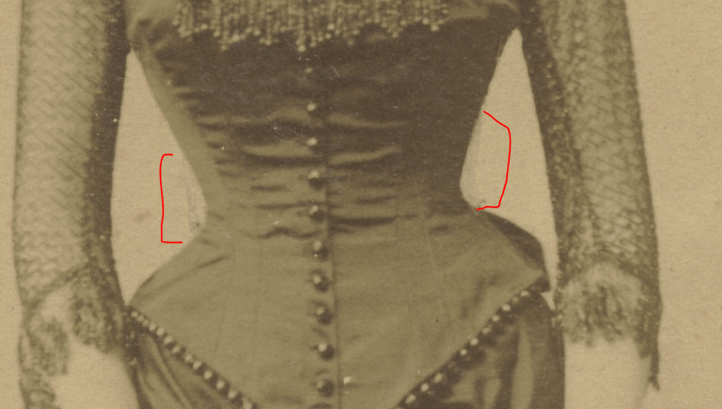 Close up view of waist reduction edits made to May Selden Kennedy's Photo