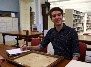 A young student sits at a desk in the LancasterHistory Research Center.