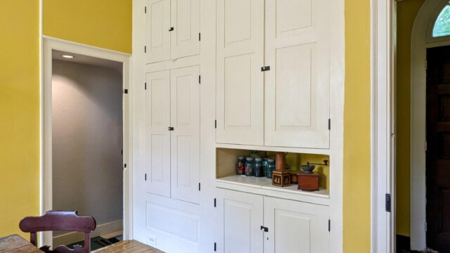 The painted cabinet doors installed on the cabinet.