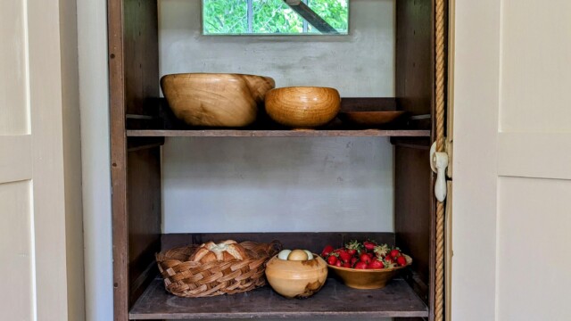 Fully functioning dumbwaiter transporting food.