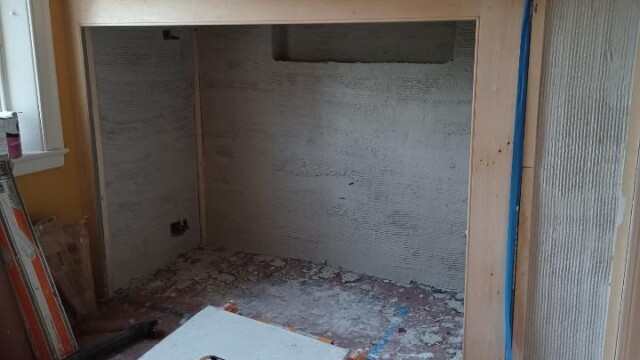 Scratch coat applied to the entire firebox.