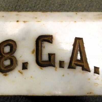 <i> White marble gavel stone, GAR Post #118. LancasterHistory, Gift of American Legion Post 372. </i> Block of white marble embossed with lettering.