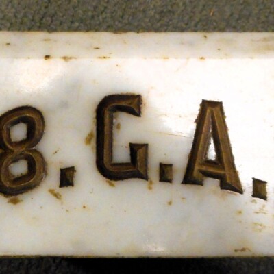 <i> White marble gavel stone, GAR Post #118. LancasterHistory, Gift of American Legion Post 372.  </i> Block of white marble embossed with lettering.