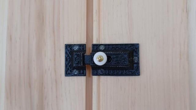 Detail shot of hardware installed to the new cabinets. This hardware was based on surviving pieces found on remaining cabinet doors.