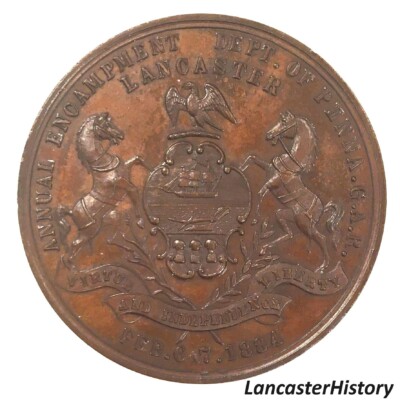<i> Commemorative coin back, GAR Department of Pennsylvania Annual Encampment, Lancaster, 1884. LancasterHistory, Gift of Civil War Museum of Philadelphia. </i> Cooper Coin with seal of Commonwealth of Pennsylvania in center.