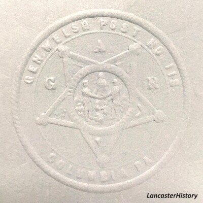 <i> Seal from seal press, GAR Post #118. LancasterHistory, Gift of American Legion Post 372.  </i> Embossed seal with GAR symbol in center.