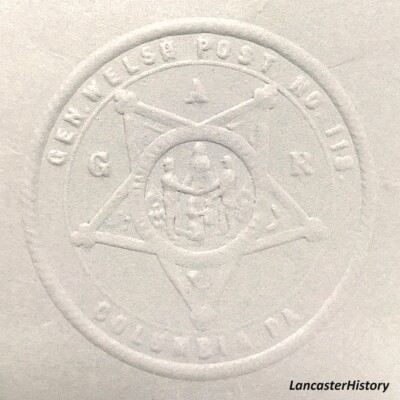 <i> Seal from seal press, GAR Post #118. LancasterHistory, Gift of American Legion Post 372. </i> Embossed seal with GAR symbol in center.