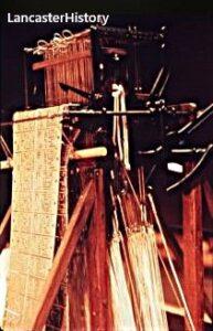 Side of a loom with attached punch cards